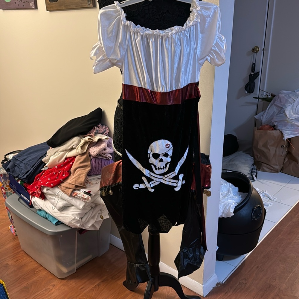 Pirate costume, ladies small/  girls large, dress and boot covers has wear